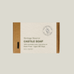 A rectangular bar of Heritage Reserve Castile Soap in a kraft paper box with a textured off-white label, shown against a solid light gray background.